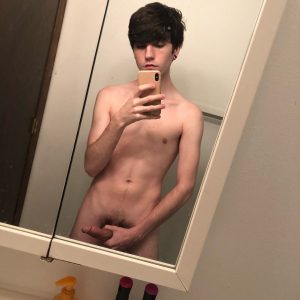 Cute nude mirror boy taking a selfie