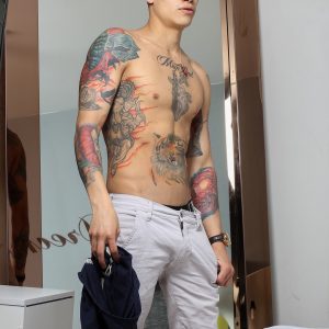 Tattooed boy with a big uncut cock