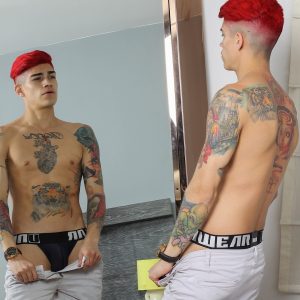 Tattooed boy with a big uncut cock