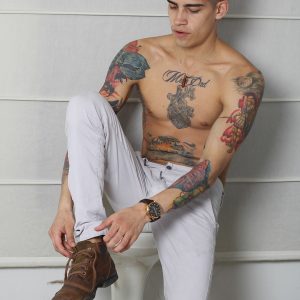 Tattooed boy with a big uncut cock