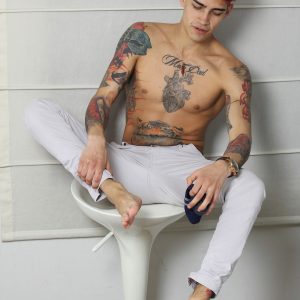 Tattooed boy with a big uncut cock