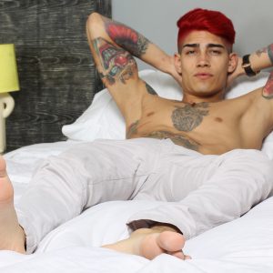 Tattooed boy with a big uncut cock