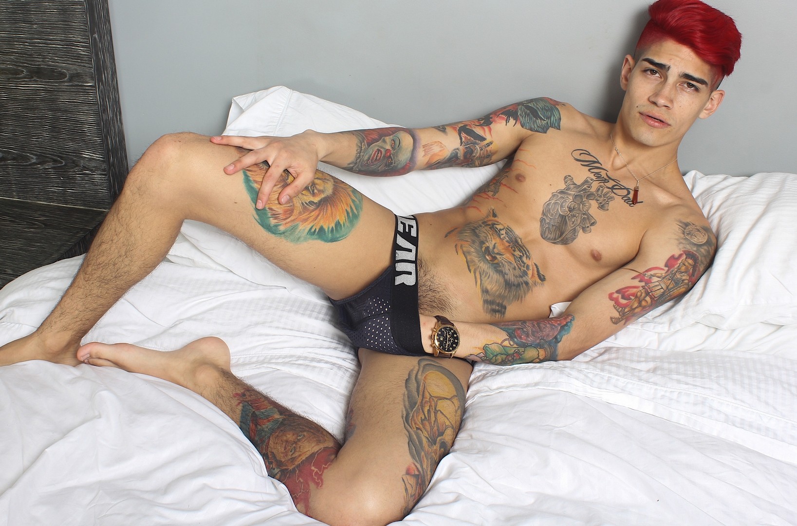 Tattooed boy with a big uncut cock