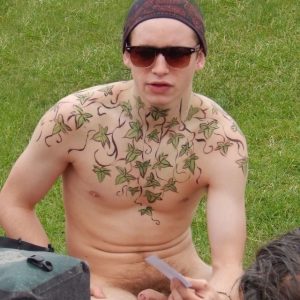 Tattooed nudist boy in public